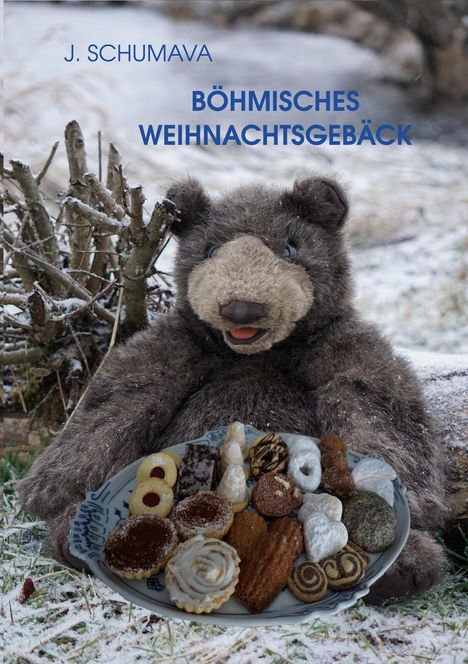 Text: "J. Schumava Böhmisches Weihnachtsgebäck". Ein Teddybär im Schnee hält einen Teller mit Weihnachtsplätzchen.