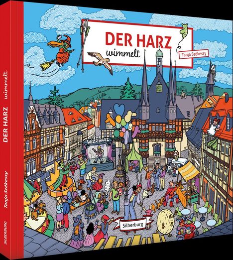 "DER HARZ wimmelt" und "Silberburg" sind hervorgehoben. Eine belebte Stadt mit Fachwerkhäusern, Figuren und Luftballons.