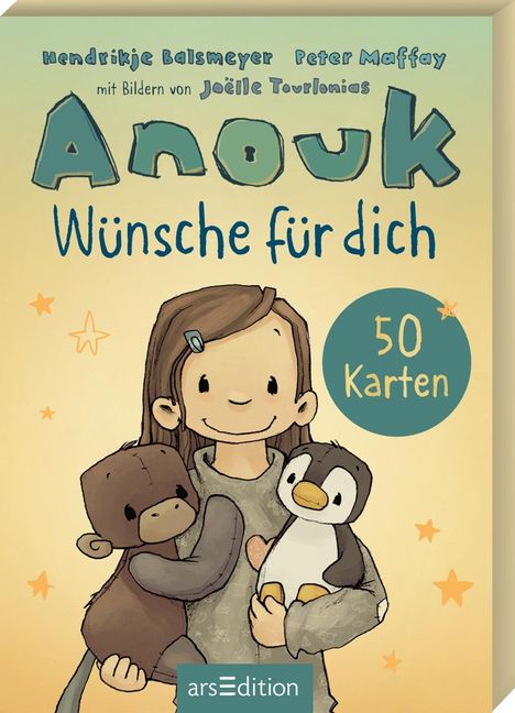 "Anouk Wünsche für dich 50 Karten" oben. Illustration: lachendes Kind mit Plüschtieren, umgeben von Sternen.