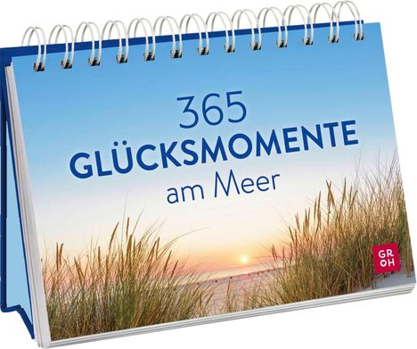 "365 GLÜCKSMOMENTE am Meer" steht vor einem Strand mit Gräsern und Sonnenuntergang. Ein rotes Logo mit "GR OH". Kartonständer.