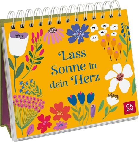 "Lass Sonne in dein Herz" umgeben von bunten Blumen und einem kleinen roten Quadrat mit "GROH".
