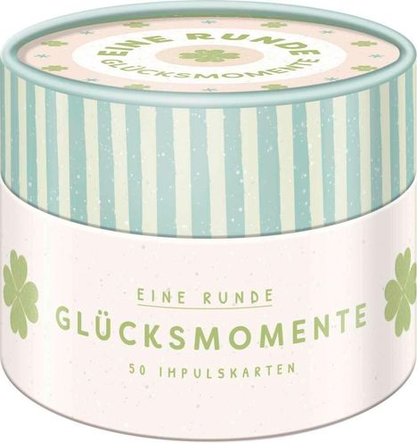 Runde Dose mit "EINE RUNDE GLÜCKSMOMENTE" und "50 IMPULSKARTEN" in grüner Schrift, Kleeblätter, pastellfarben.