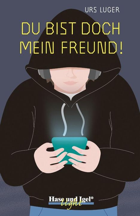 "DU BIST DOCH MEIN FREUND!" Ein Mensch im schwarzen Hoodie hält ein leuchtendes Handy. Oben steht "URS LUGER".
