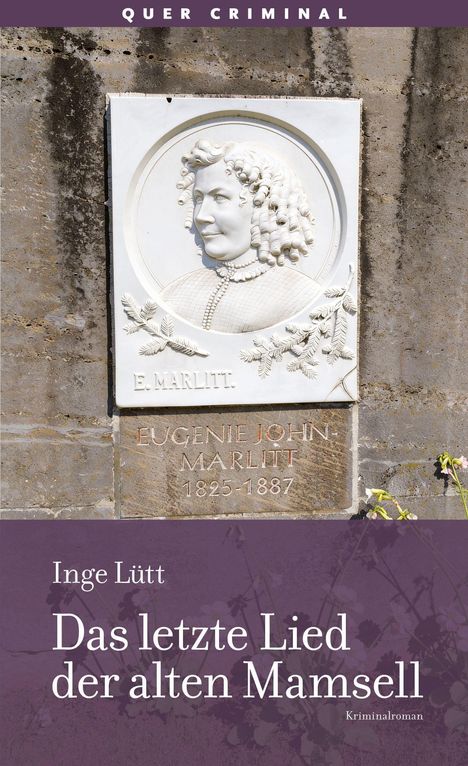 „Quer Criminal“ steht oben. Ein Relief von E. Marlitt mit Geburts- und Sterbejahren. Titel: „Das letzte Lied der alten Mamsell“.