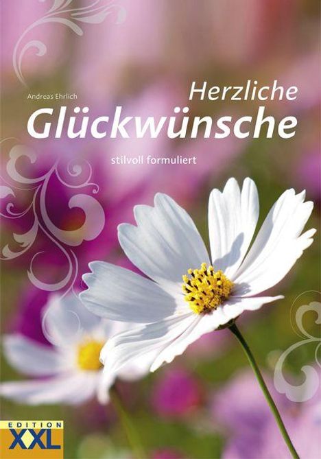"Herzliche Glückwünsche, stilvoll formuliert." Im Hintergrund weiße Blumen vor einem unscharfen, bunten Hintergrund.