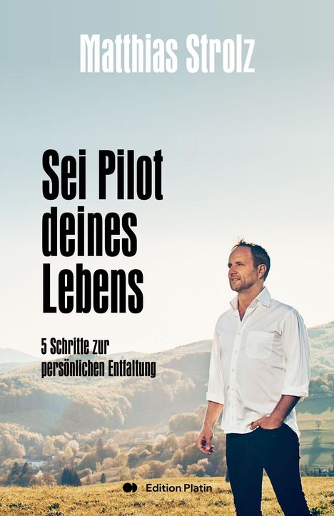 Text: „Matthias Strolz“, „Sei Pilot deines Lebens“, „5 Schritte zur persönlichen Entfaltung“. Ein Mann steht auf einem Feld.