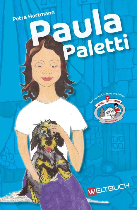 „Paula Paletti“ steht im Vordergrund. Eine gezeichnete Person mit Sommersprossen und Hund auf dem Shirt vor blauem Hintergrund.