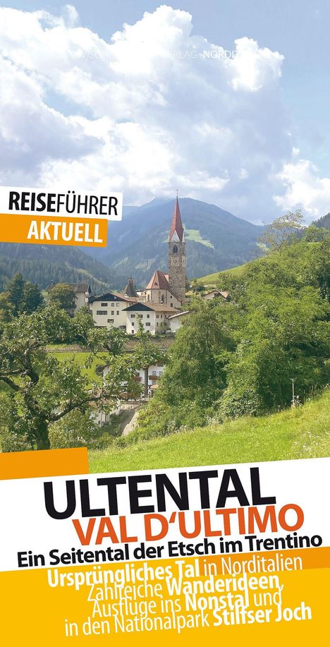 Reiseführer: Ultental, Val d'Ultimo, mit Kirche im Tal vor bewaldeten Bergen unter bewölktem Himmel.