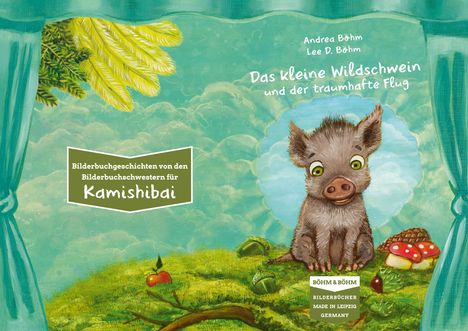 "Bilderbuchgeschichten von den Bilderbuchschwestern für Kamishibai" steht in einem Rahmen. Ein fröhliches Wildschwein sitzt im Gras.