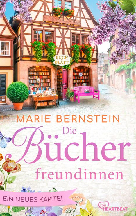 Texte: "BUCH & BLÄTT", "MARIE BERNSTEIN", "Die Bücherfreundinnen", "EIN NEUES KAPITEL". Fachwerkhaus mit Buchgeschäft und Blumen.
