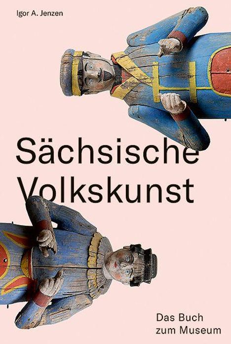 "Sächsische Volkskunst", "Das Buch zum Museum". Drei bunte Holzfiguren in traditioneller Tracht sind abgebildet.