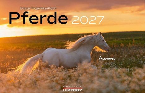 Text: "Edyta Trojańska-Koch", "Pferde 2027", "Aurora". Ein weißes Pferd läuft durch ein Feld bei Sonnenuntergang.