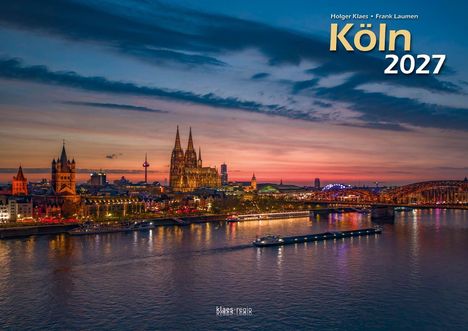 Text: "Holger Klaes • Frank Laumen, Köln 2027." Stadtansicht bei Sonnenuntergang, Dom und Rhein im Vordergrund.