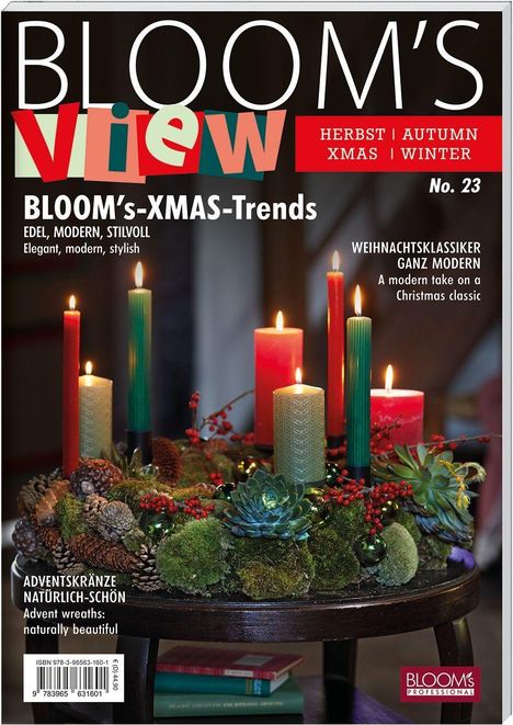 Titel: "BLOOM's VIEW", Ausgabenummer: 23. Dekorierter Adventskranz mit brennenden Kerzen und natürlichen Elementen.