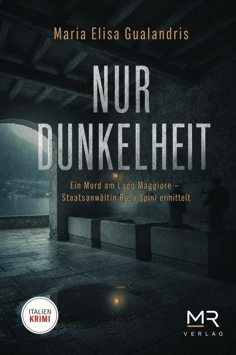 "Maria Elisa Gualandris. NUR DUNKELHEIT. Ein Mord am Lago Maggiore – Staatsanwältin Rosa Spini ermittelt. Italien Krimi. MR Verlag." Ein regnerischer, düsterer Unterstand am See.