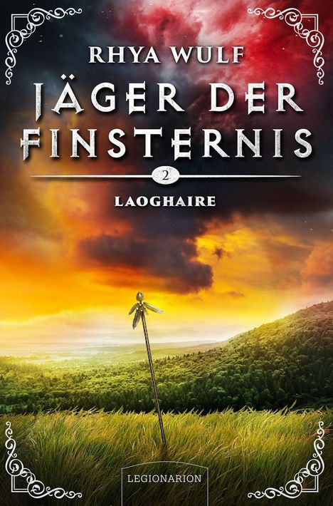 „Rhya Wulf, Jäger der Finsternis 2, Laoghaire“. Ein Stab im Gras, Hintergrund: dramatischer Himmel über Hügeln.