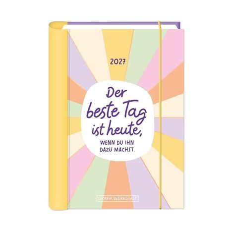Der Text lautet: "2027. Der beste Tag ist heute, wenn du ihn dazu machst." Bunte, strahlenförmige Illustration auf Notizbuch.