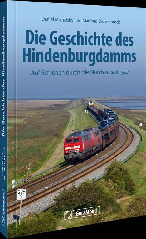 „Die Geschichte des Hindenburgdamms“ von Daniel Michalsky und Manfred Diekenbrock. Zug fährt durch Marschlandschaft.