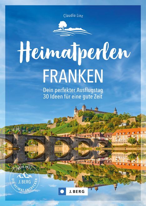 "Heimatperlen Franken: Dein perfekter Ausflugstag. 30 Ideen für eine gute Zeit." Burg auf Hügel mit Brücke im Vordergrund.