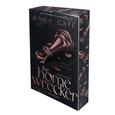 Es zeigt ein Buchcover: Titel "the home wrecker", mit einem umgestürzten Schachkönig, violett auf dunklem Hintergrund.