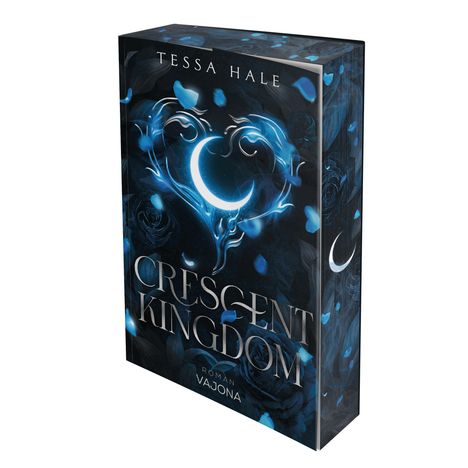 "Crescent Kingdom" und "Roman Vajona" auf einem Buchcover. Ein leuchtender Halbmond in Herzform, umgeben von blauen Rosenblättern.