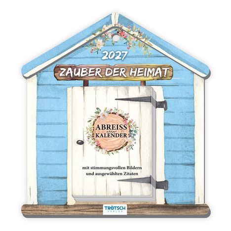 Ein Kalender in Form eines blauen Hauses mit der Aufschrift "Zauber der Heimat 2027". Verziert mit Blumenornamenten.