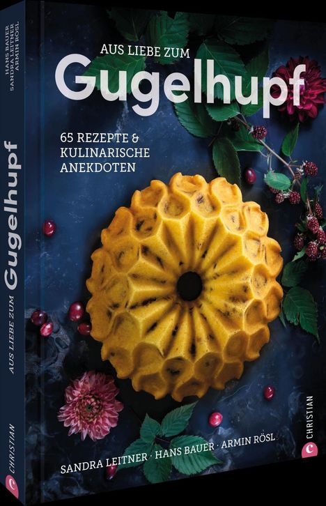 „Aus Liebe zum Gugelhupf. 65 Rezepte & kulinarische Anekdoten.“ Ein Gugelhupf liegt neben Beeren und Blättern.
