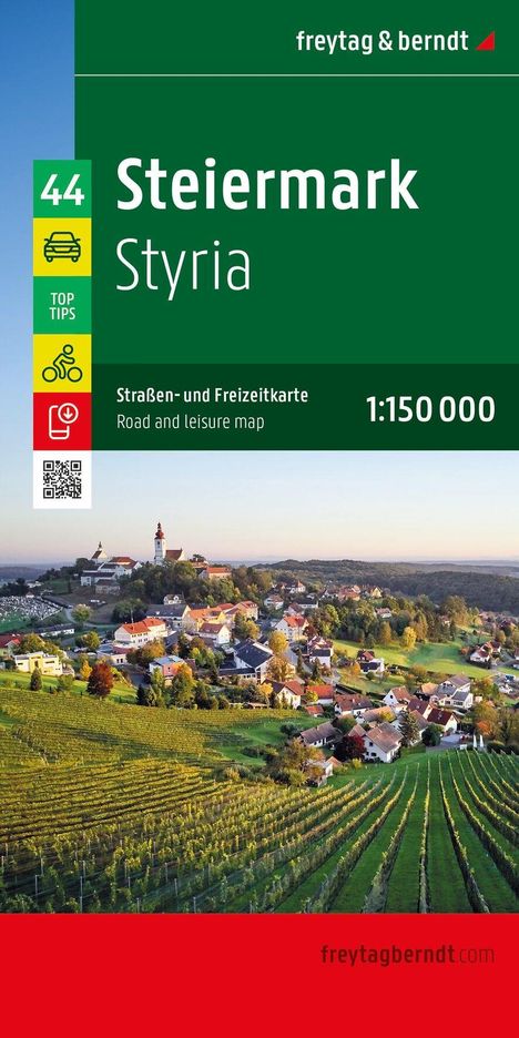 "Steiermark Styria" steht auf einer Karte. Darunter Landschaft mit Hügeln, Weinbergen und einem Dorf im Sonnenlicht.