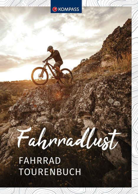 Oben „KOMPASS“, unten „Fahrradlust Fahrradtourenbuch“. Ein Radfahrer fährt auf einem steinigen Weg bei Sonnenuntergang.