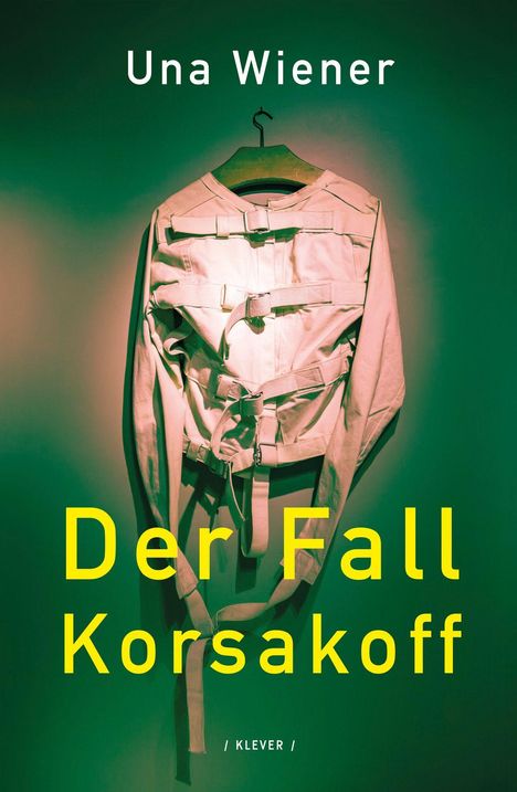 Der Text zeigt "Una Wiener" und "Der Fall Korsakoff". Eine Zwangsjacke hängt an einem Kleiderbügel vor grünem Hintergrund.
