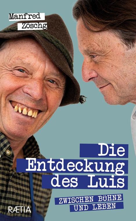 _Text: Manfred Zöschg, Die Entdeckung des Luis, Zwischen Bühne und Leben, RAETIA. Zwei ältere Männer, einer mit Hut, lachend._