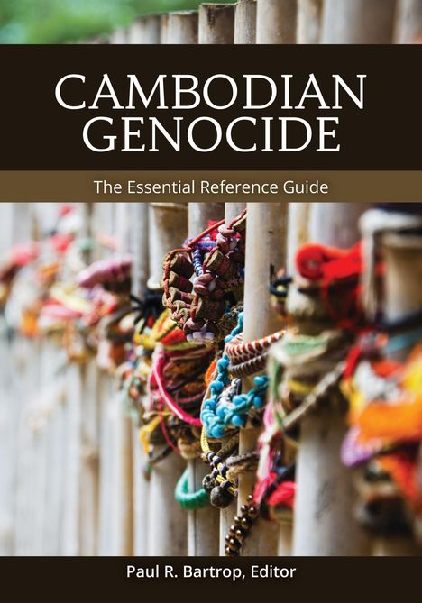 Text: Cambodian Genocide, The Essential Reference Guide, Paul R. Bartrop, Editor. Hintergrund: Bunte Armbänder an Holzstäben.