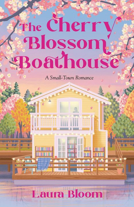 "The Cherry Blossom Boathouse" in rosa Schrift, "A Small-Town Romance" darunter. Ein gelbes Bootshaus mit Lichterkette, umgeben von blühenden Bäumen.