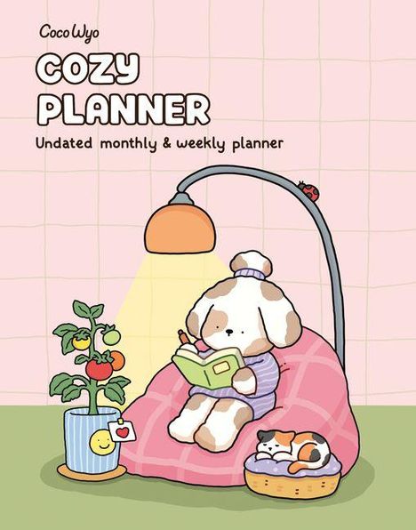 "CocoWyo Cozy Planner, Undated monthly & weekly planner" in verspielten Buchstaben. Ein Hund liest im Sessel, daneben eine topfgepflanze.