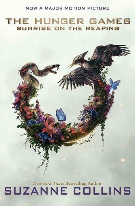 "Now a Major Motion Picture. The Hunger Games: Sunrise on the Reaping. Suzanne Collins." Illustration: Vogel, Schlange, Blumen.