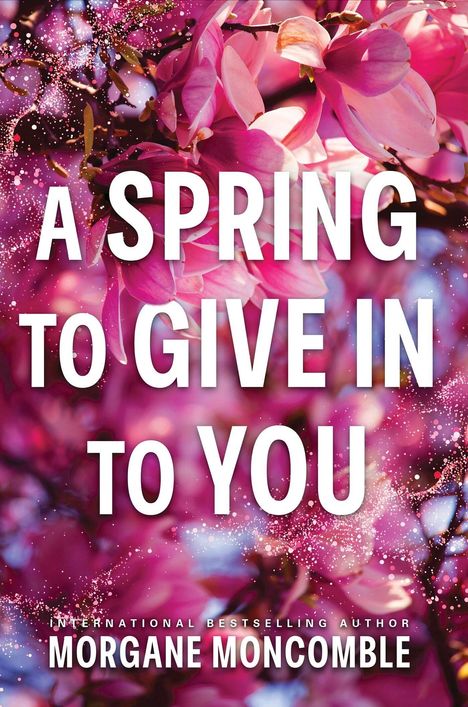 Text: "A SPRING TO GIVE IN TO YOU" und "MORGANE MONCOMBLE". Hintergrund: Pinke Magnolienblüten.