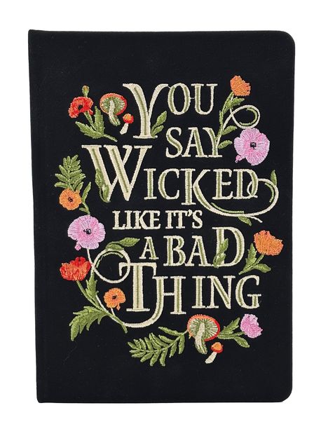 „YOU SAY WICKED LIKE IT'S A BAD THING“ in gestickter Schrift mit bunten Blumen und Blättern verziert.