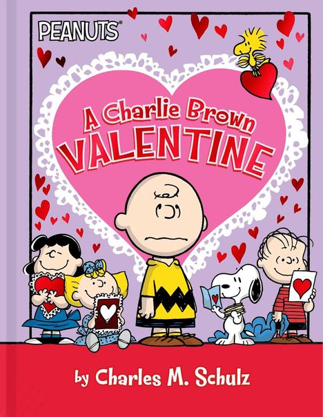„PEANUTS“, „A Charlie Brown Valentine“, „by Charles M. Schulz“. Fünf Figuren halten Herzen vor einem rosa Hintergrund.