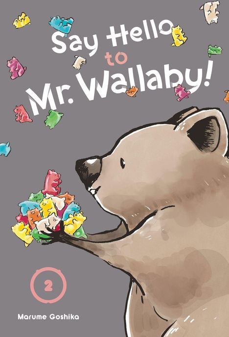Text: "Say Hello to Mr. Wallaby!", "Marume Goshika", "2". Illustration eines lächelnden Tieres mit bunten, kleinen Kreaturen.