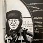Texte: "Oidupaa Vladimir Oiun", "Divine music from a jail", "TUVA". Illustration eines Mannes mit Pelzmütze und Brille.