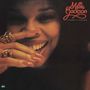 Millie Jackson, A Moment's Pleasure, Frau lächelt, hält Hand vorm Gesicht, lange rote Nägel, goldene Ringe.