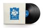 Text auf weißem Cover: "YES", darunter "Tales from Topographic Oceans". Vier schwarze Schallplatten daneben.
