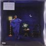 Alex Isley - When the City Sleeps. Frau in blauem Kleid, Lampe, Tisch mit Blumen, Stuhl, Mondsichel an der Wand.