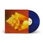 Ein blaues Vinyl mit einem Cover, das eine große gelbe Muschel auf orangefarbenem Hintergrund zeigt.