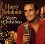 "Harry Belafonte Merry Christmas" steht in eleganter Schrift. Ein Mann in rotem Hemd hält ein Mikrofon vor einem Weihnachtsbaum.