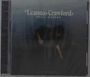 "Leanna Crawford Still Waters Deluxe" in weißer Schrift. Frau beugt sich nach unten, dunkler Hintergrund.