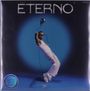 Text oben: "ETERNO". Mann in weißer Kleidung, Mikrofon in Hand, vor blauem Hintergrund, steht in dynamischer Pose.