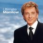 "Ultimate Manilow" erscheint auf einem Albumcover neben zwei Schallplatten. Ein Mann im Anzug lächelt freundlich.