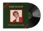 "Barry Manilow, Christmas Essentials" auf einem dunkelgrünen Albumcover mit rotem Rand und einem Foto.