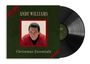 "ANDY WILLIAMS Christmas Essentials". Dunkelgrüne Hülle mit roter Schleife und Foto eines Mannes. Eine Schallplatte.